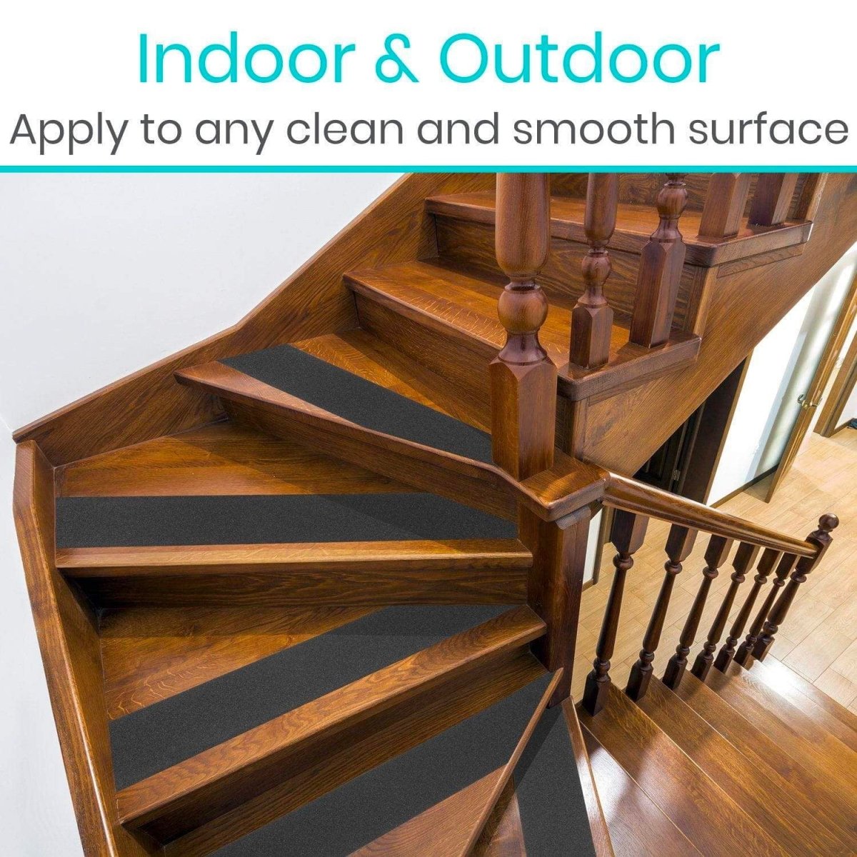 Black anti-slip stair treads on wooden steps for safer footing