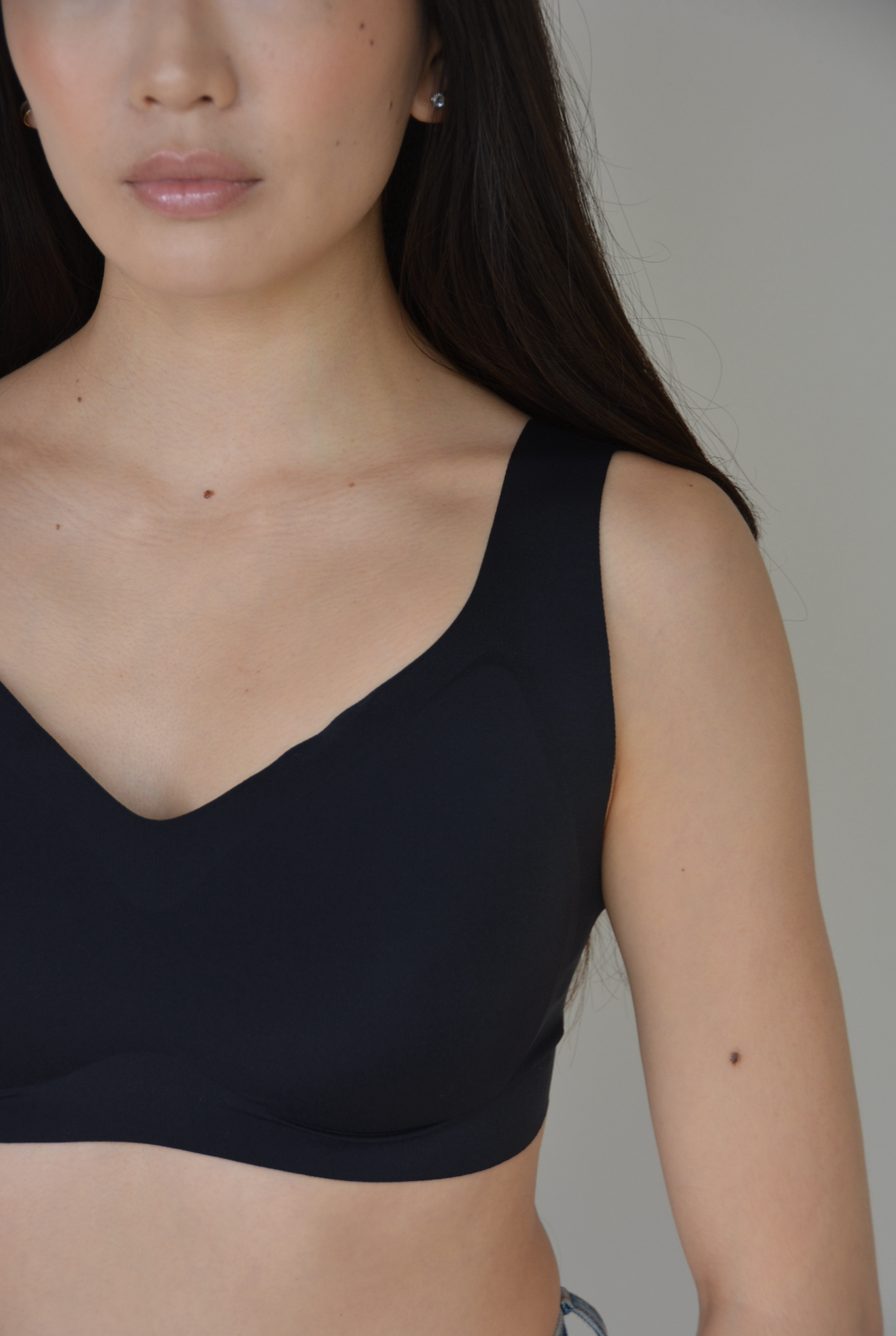 Black v-neck lift bra with wide shoulder straps and molded cups.