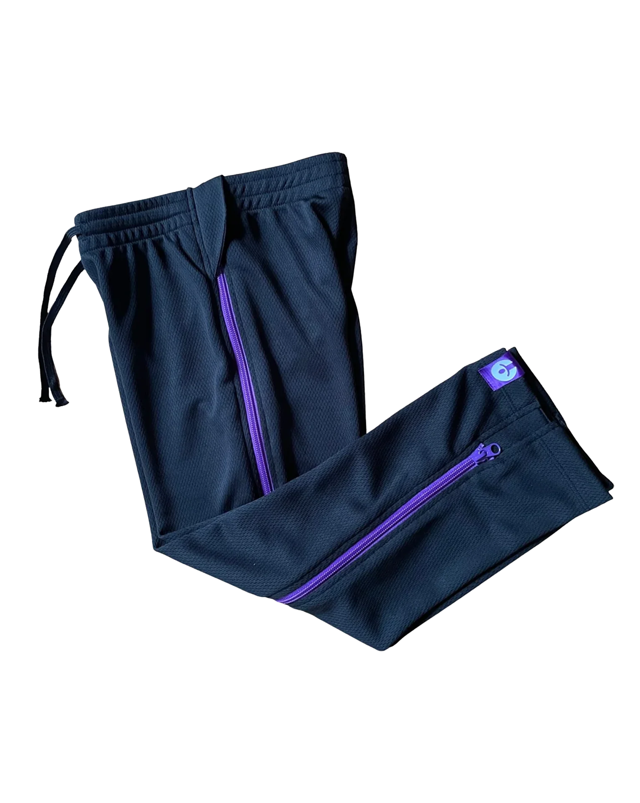 Navy blue pants with purple zippers on a white background