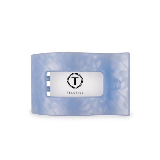 Medium flat rectangle hair clip, translucent light blue with inset center branding