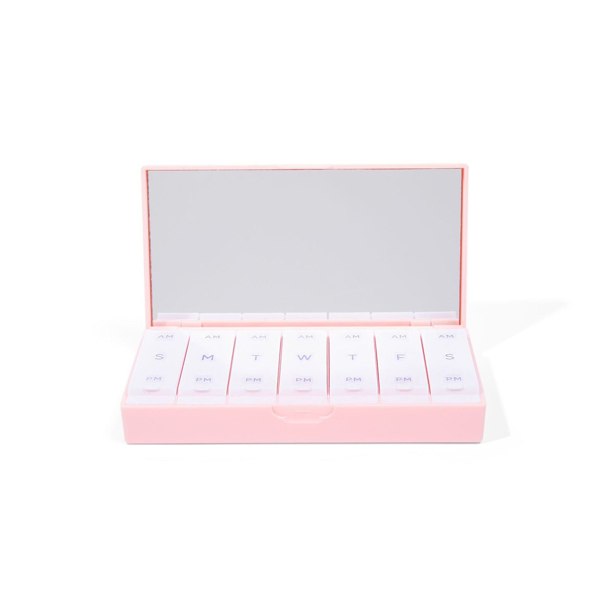 Blush pink AM/PM pill box open lid with row of labeled pill compartments