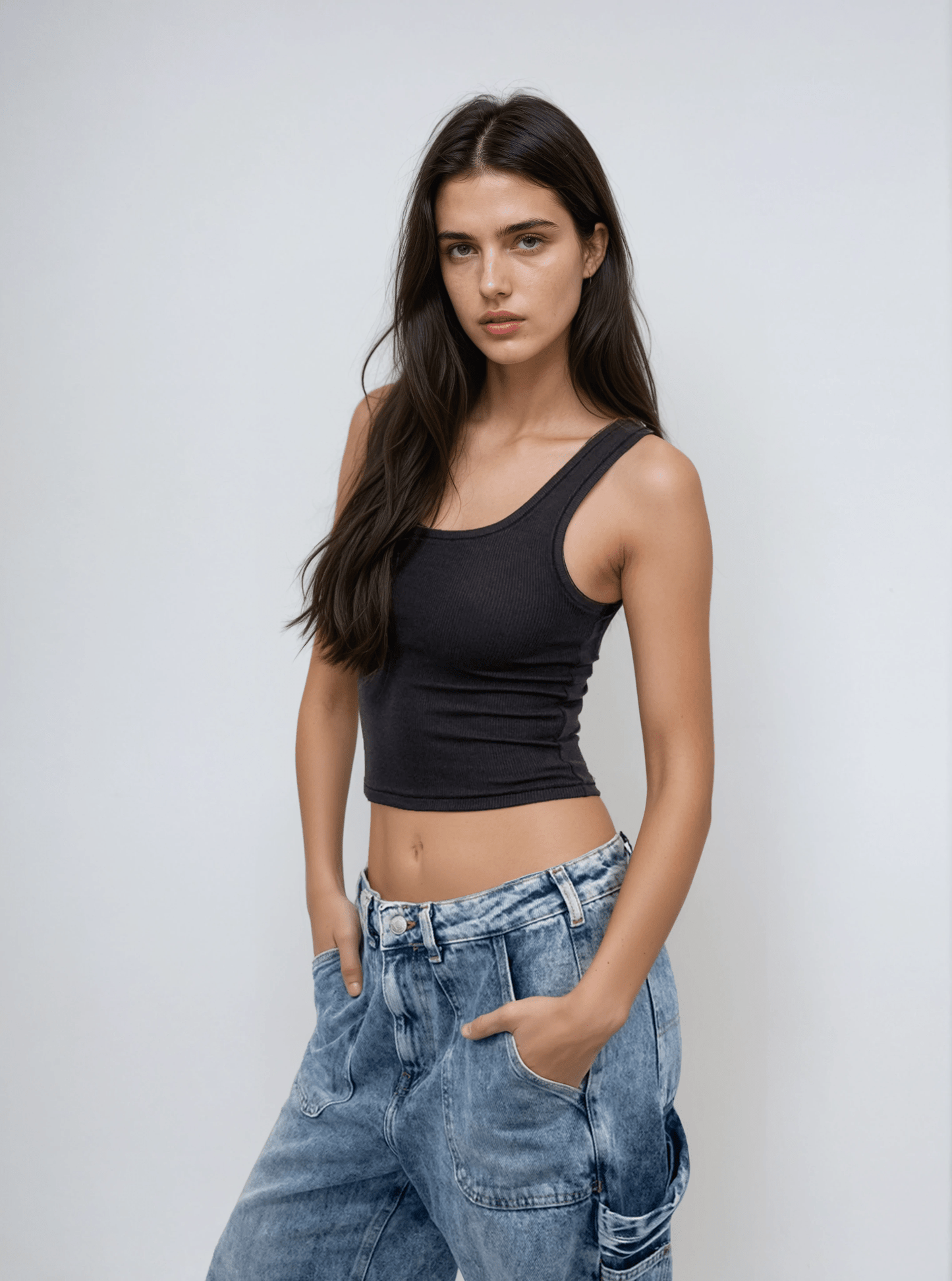 Black scoop-neck sleeveless body tank, fitted torso with thin straps.
