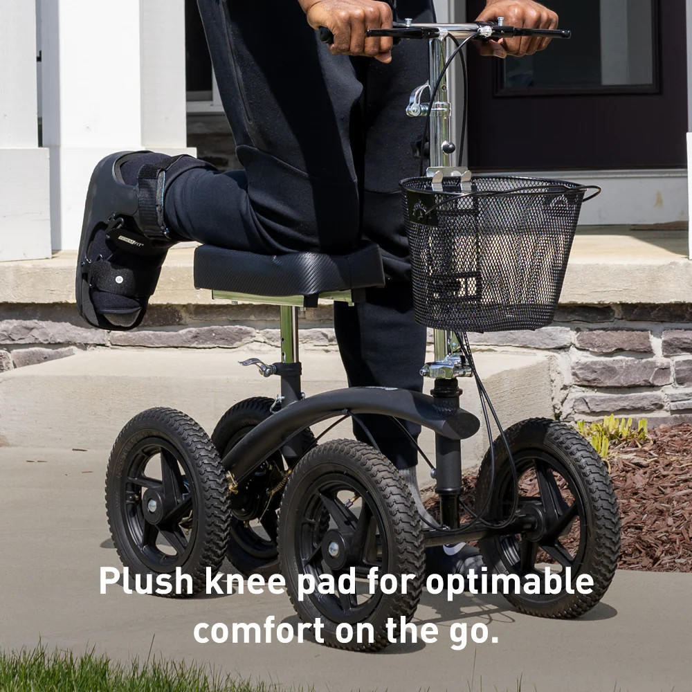 All-terrain knee walker with larger padded knee pad, mesh basket, and hand controls