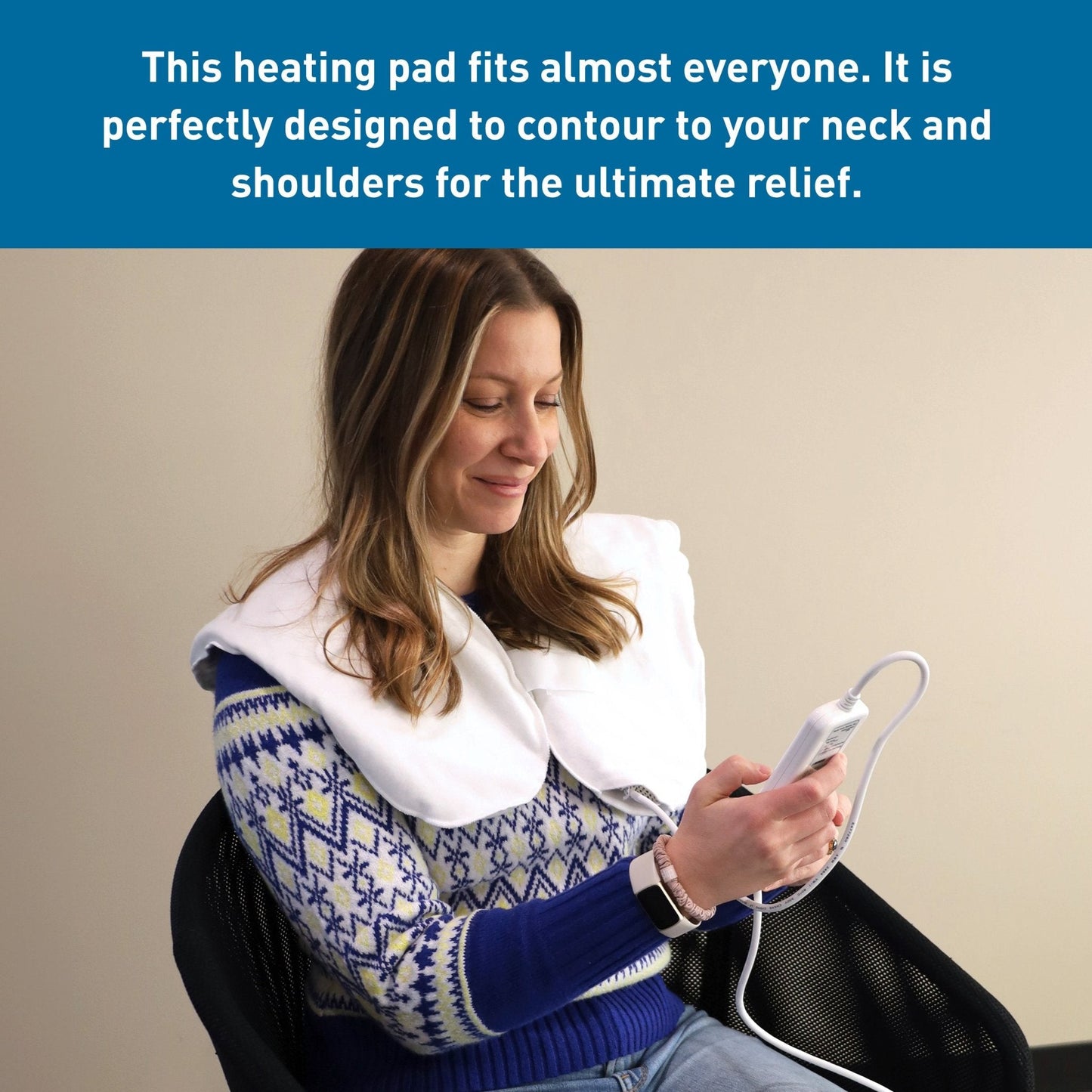 White neck-and-shoulder heating pad with digital controller connected by cable