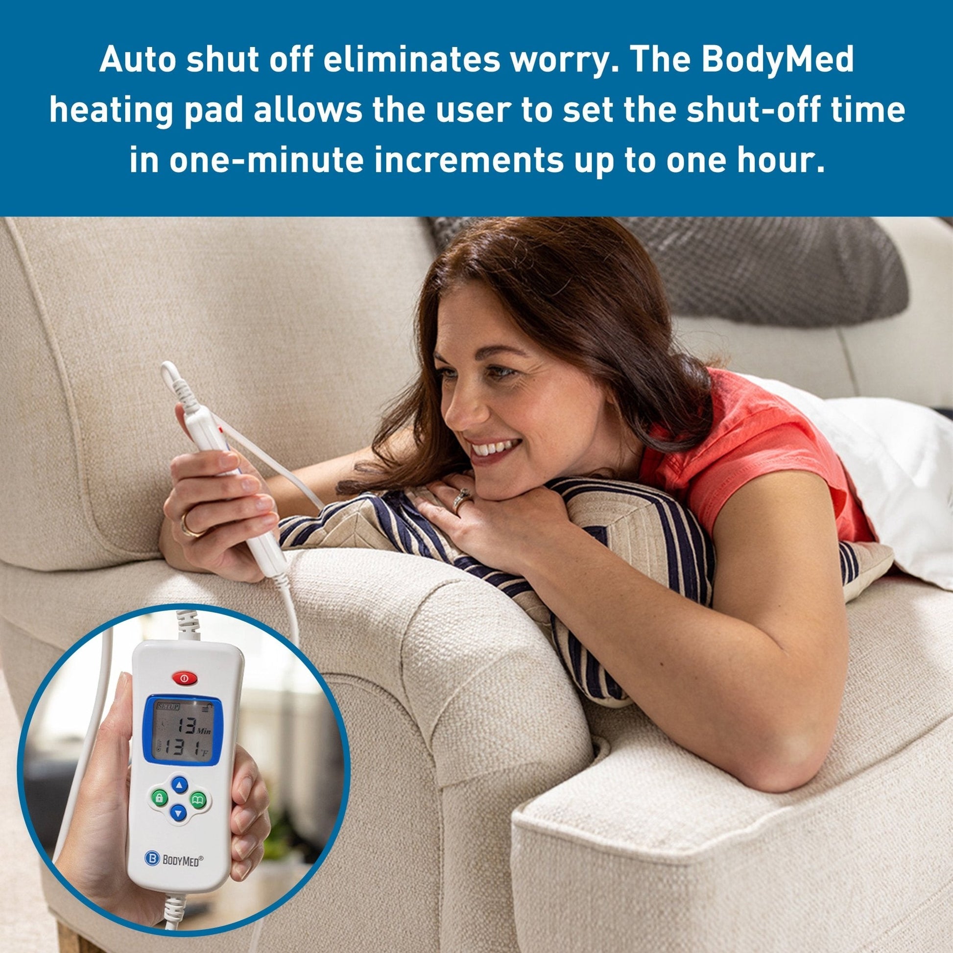 White heating pad with digital controller in hand and connected power cable