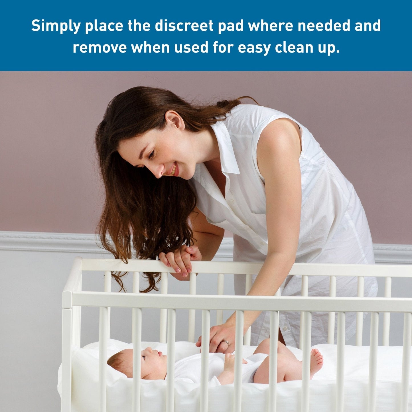 Disposable underpad in place on changing area; white absorbent pad with blue side border