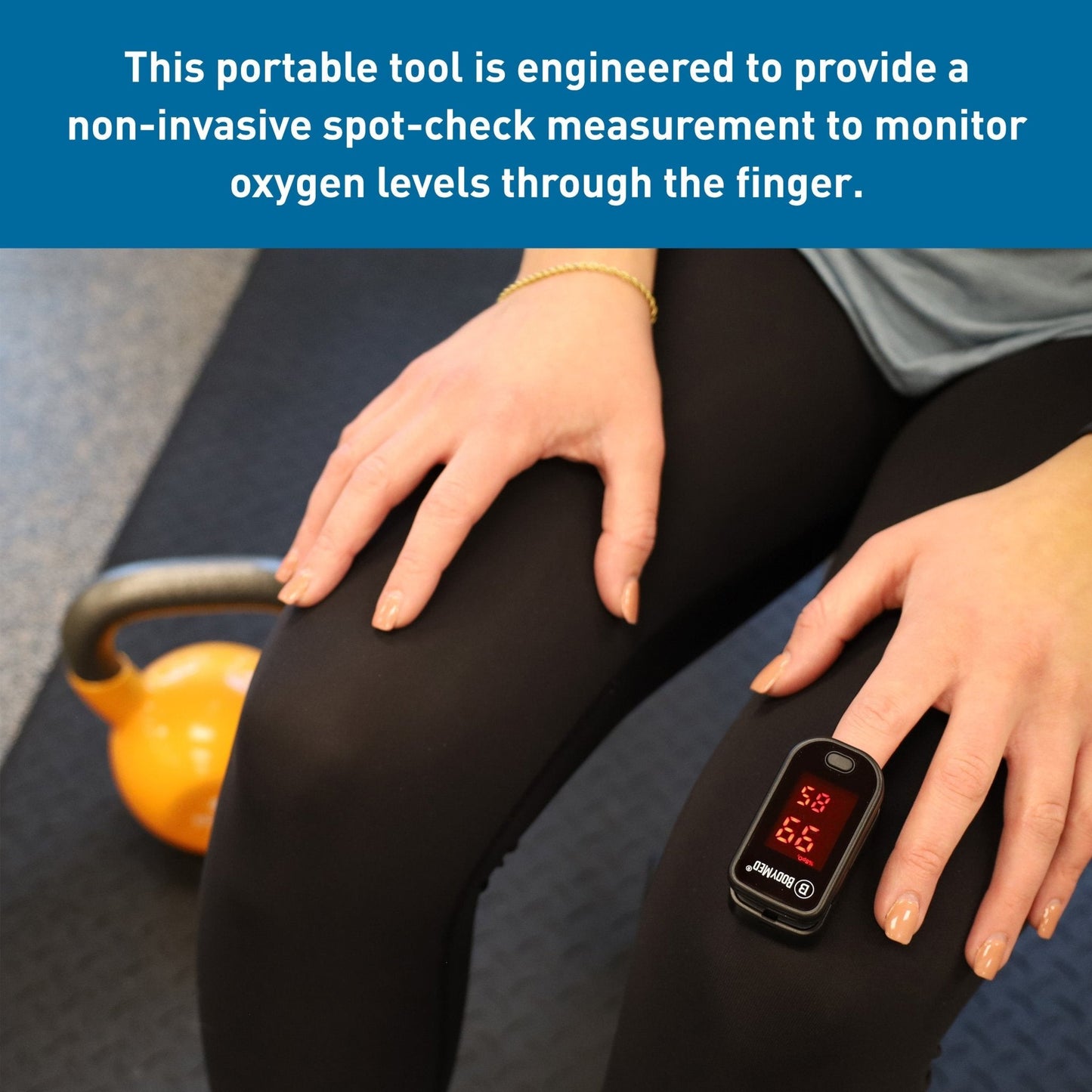 Fingertip pulse oximeter clamped on finger, red LED digits visible