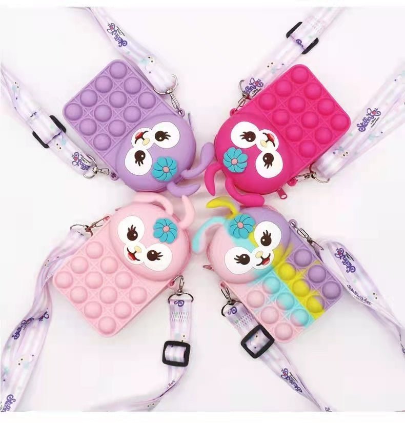 Bunny fidget crossbody bags in lavender, pink, light pink, and rainbow pop-bubble silicone
