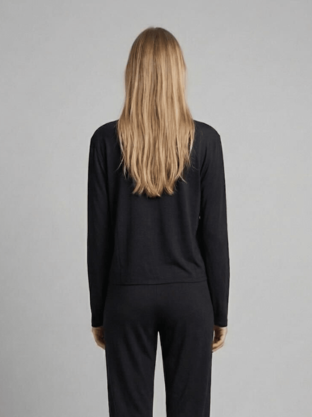 Black long-sleeve pajama top from back view with crew neckline