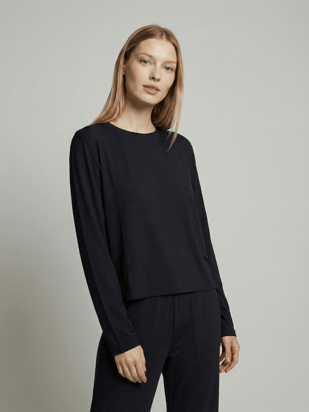 Black long-sleeve pajama top with crew neck and relaxed sleeves