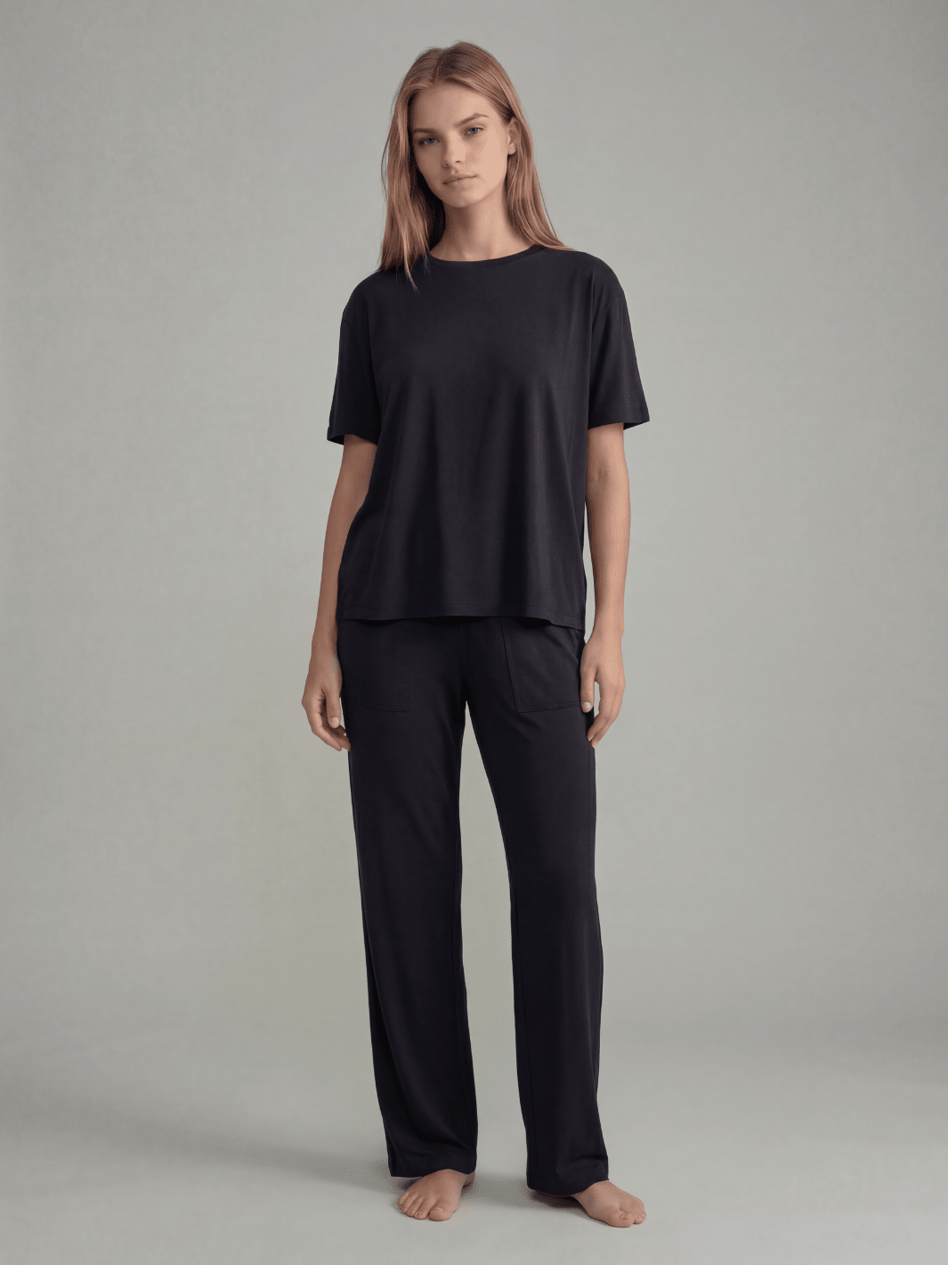 Black pajama set with short-sleeve tee and straight wide-leg pants, full length