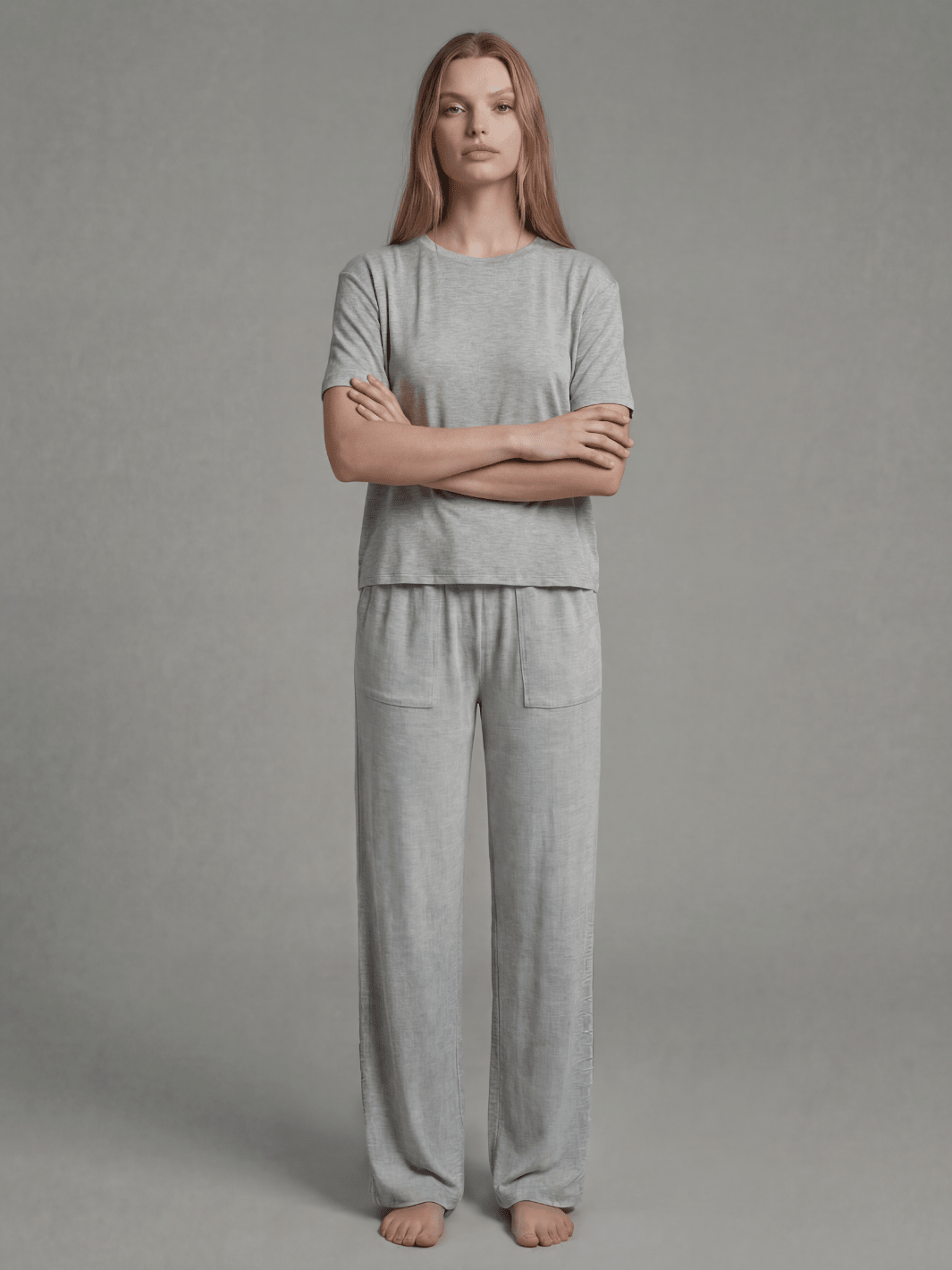 Heather grey pajama set with short-sleeve tee and wide-leg pants, arms crossed