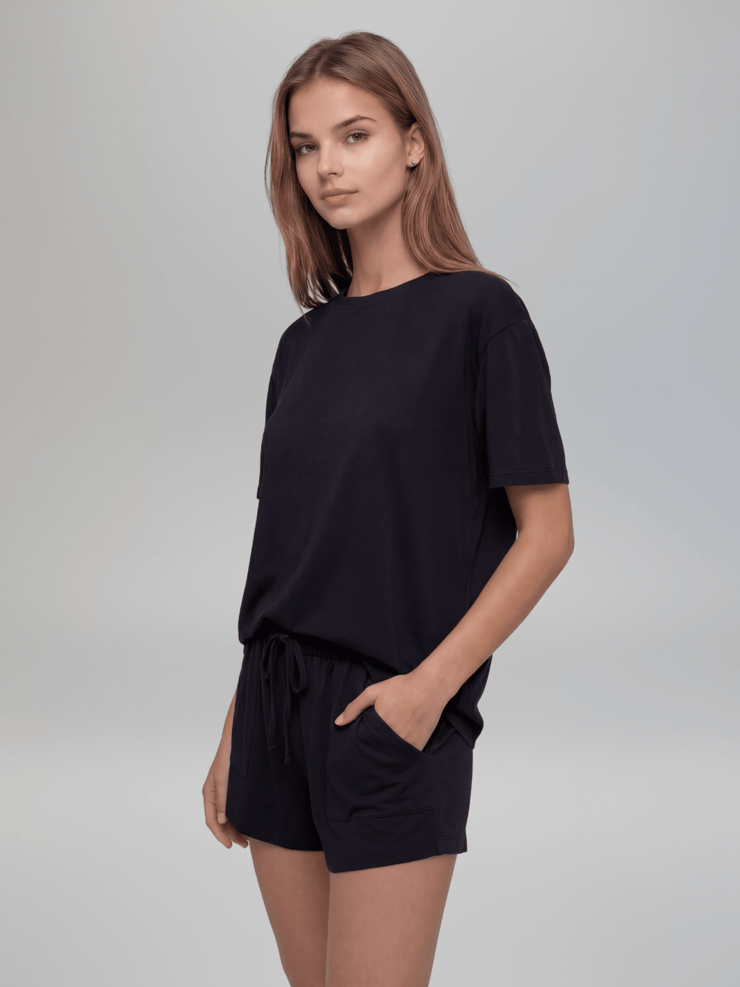 Black pajama tee and shorts set, front view, drawstring waist and pocket detail