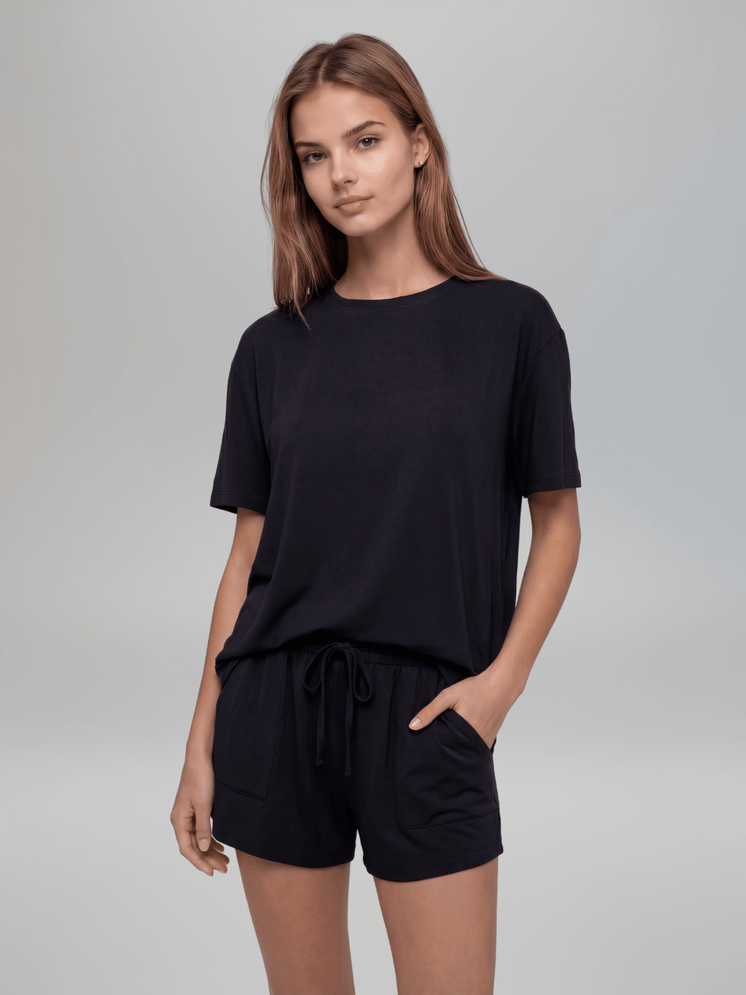Black short-sleeve crewneck pajama tee with relaxed drape, soft knit.