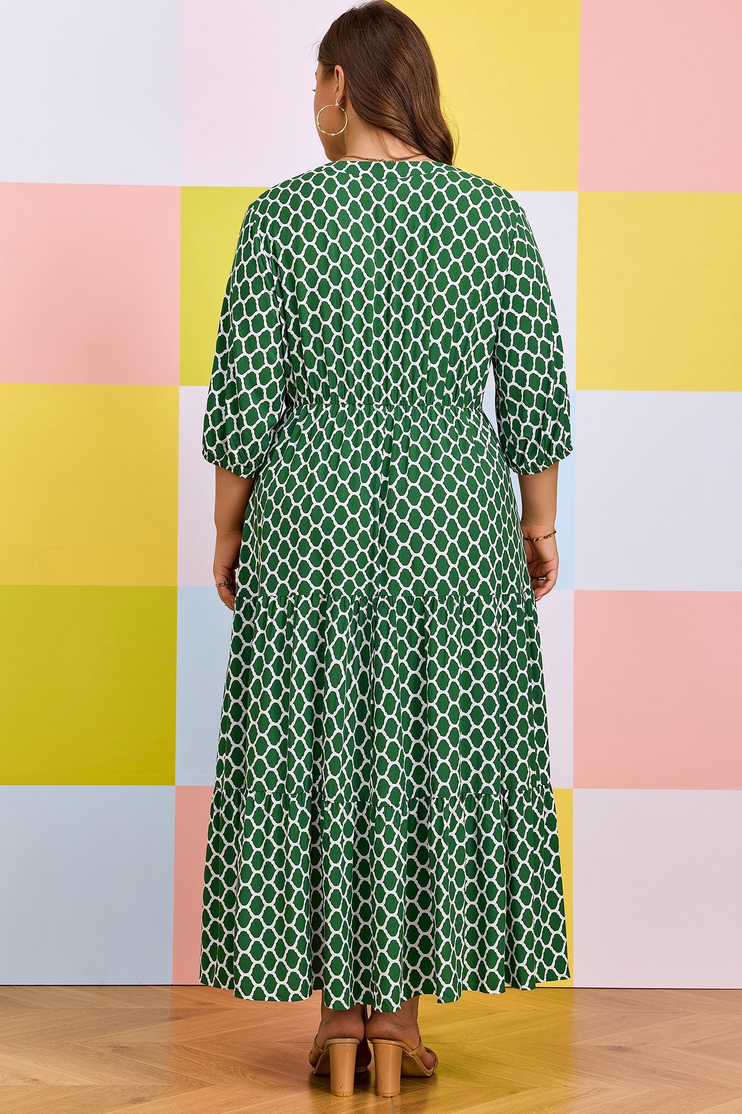 Green geometric-print PLUS dress with ruffle hem, back view, three-quarter sleeves