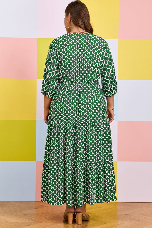 Green geometric-print PLUS dress with ruffle hem, back view, three-quarter sleeves
