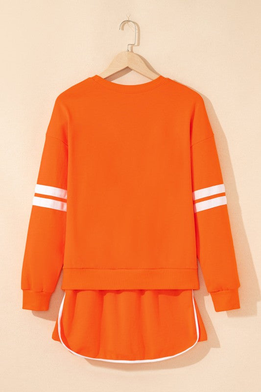 Orange varsity stripe pullover and mini skirt set, back view with white trim