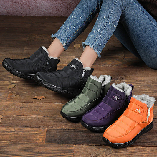 Women’s ankle snow boots, black, green, purple, and orange pair lineup with fur trim