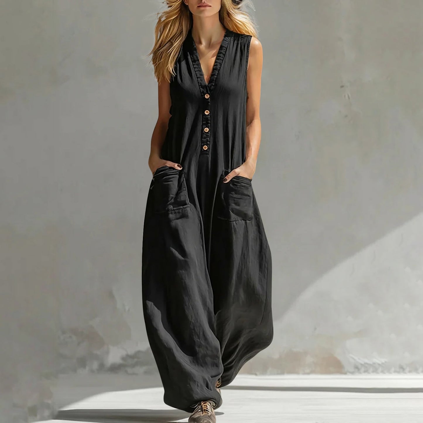 Black sleeveless wide-leg jumpsuit with V-neck button front and side pockets.