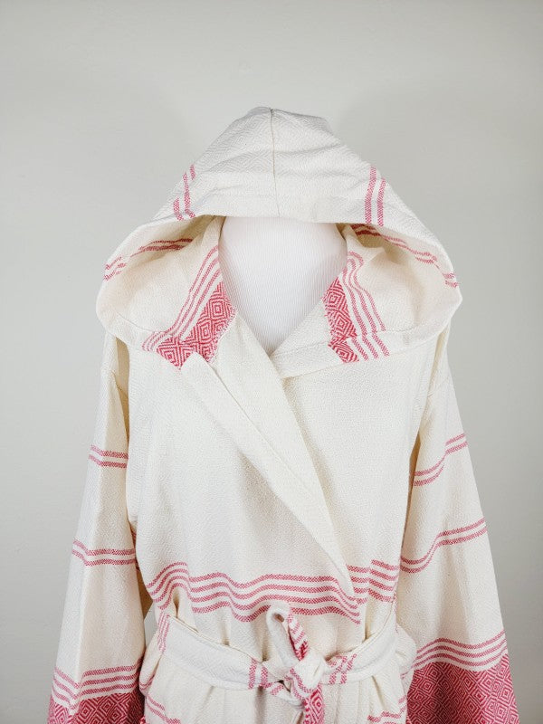 Unisex hooded bathrobe in cream with pink stripes and diamond motifs, tied waist and long sleeves.