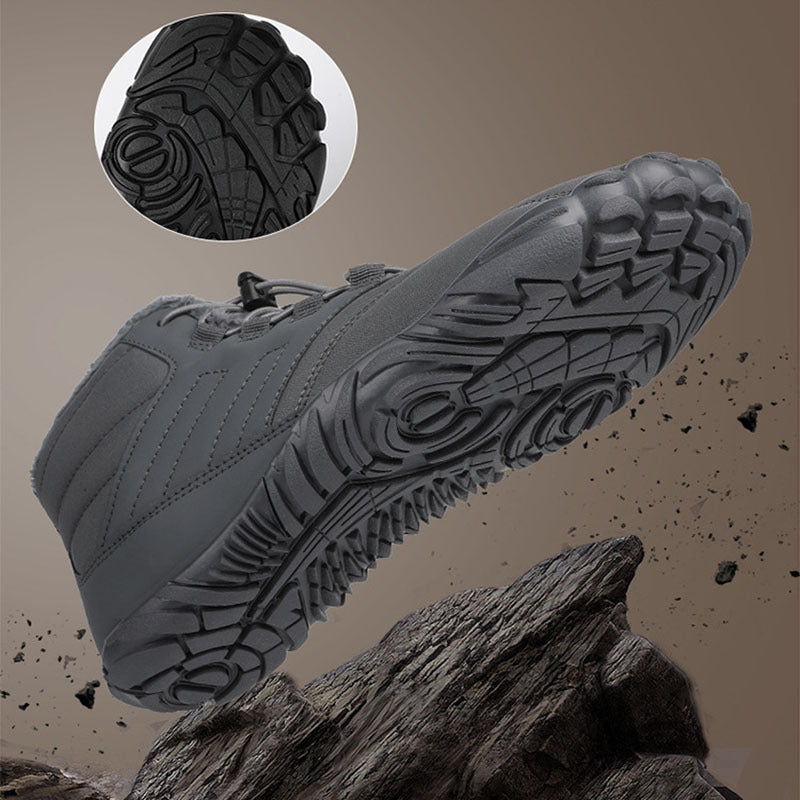 Gray winter slip-on boots with detailed tread outsole, side view close-up.