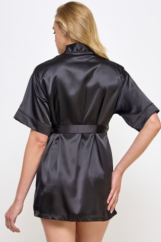 Back view of black satin V-neck robe with tie belt and short sleeves