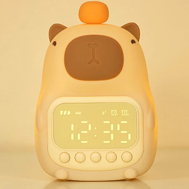 Capybara-shaped night light alarm clock with glowing digital time display and buttons