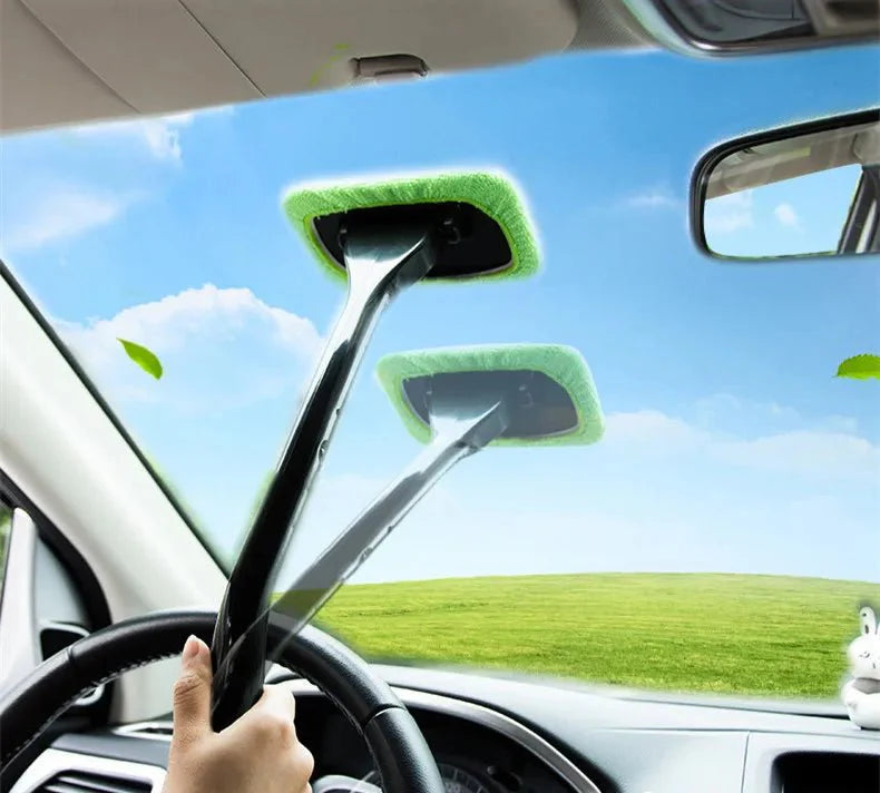 Green microfiber car window cleaning brush head on a black pole