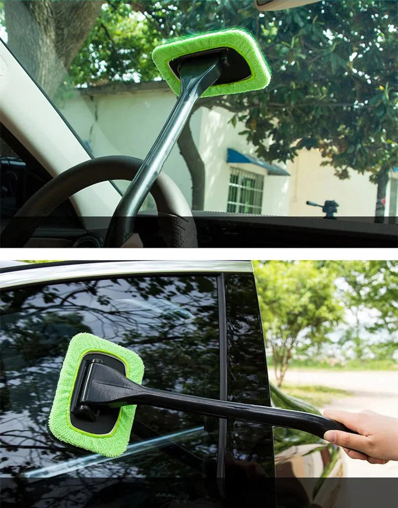 Car window cleaning brush with green microfiber pad on silver handle for windshield
