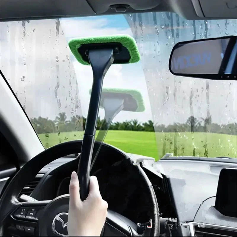Green microfiber window cleaning brush attached to a black pole