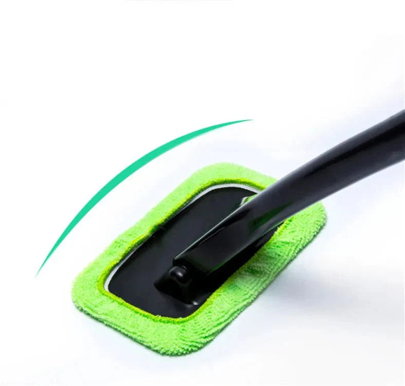 Green microfiber pad of a car window cleaning brush on a black squeegee head