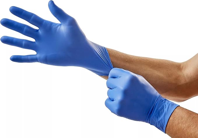 Blue nitrile exam gloves being worn on both hands