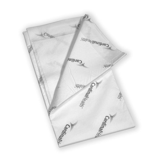 White quilted underpads with wings, folded—40 x 57 in