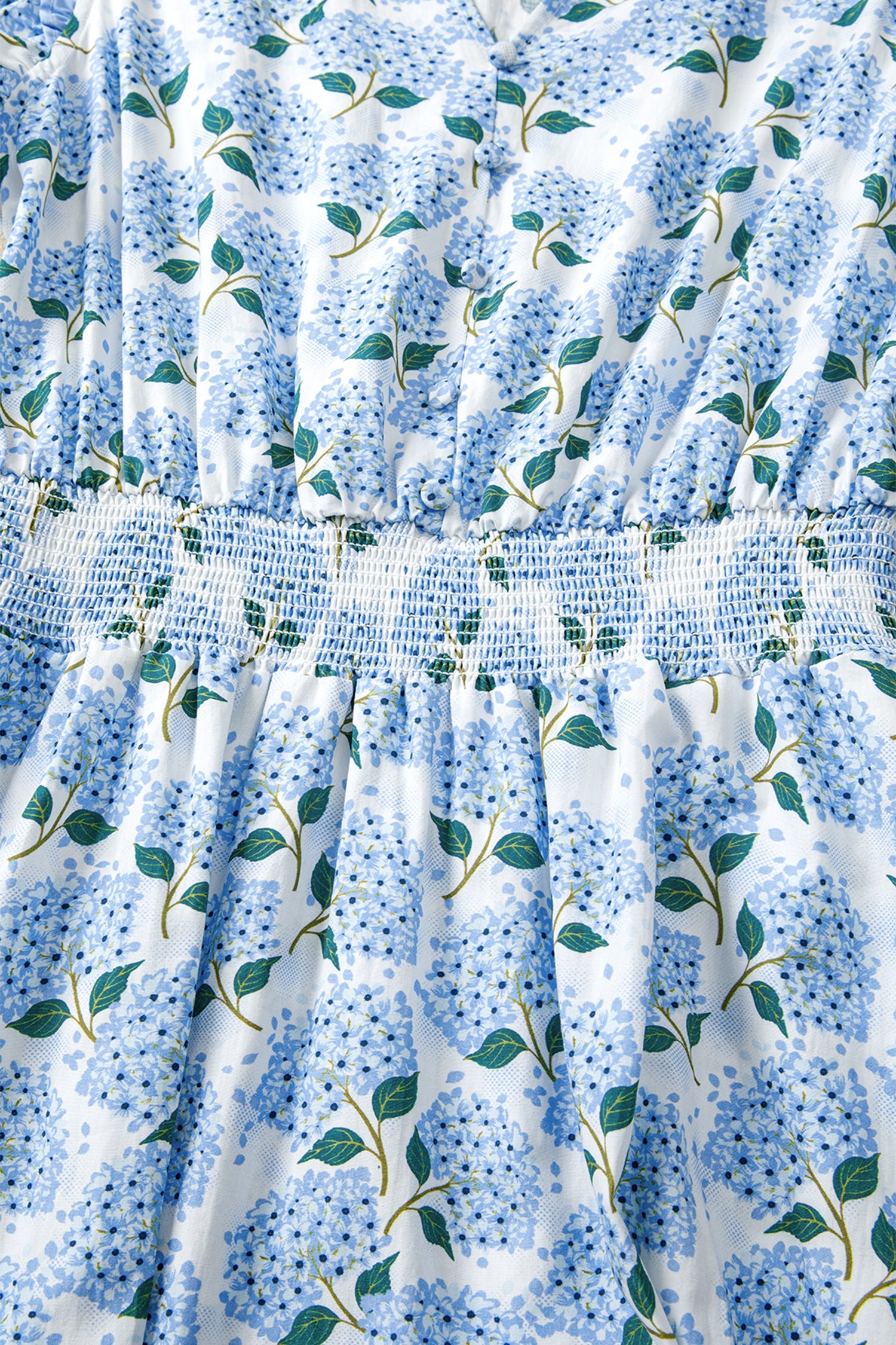 Sky blue long dress with smocked bodice and tiered skirt, floral leaf print