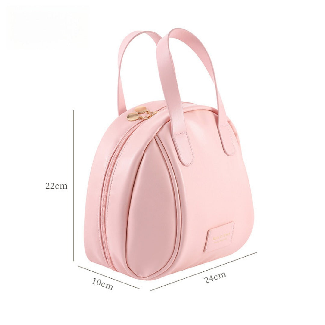 Pink waterproof makeup tote bag with two top handles and front patch label