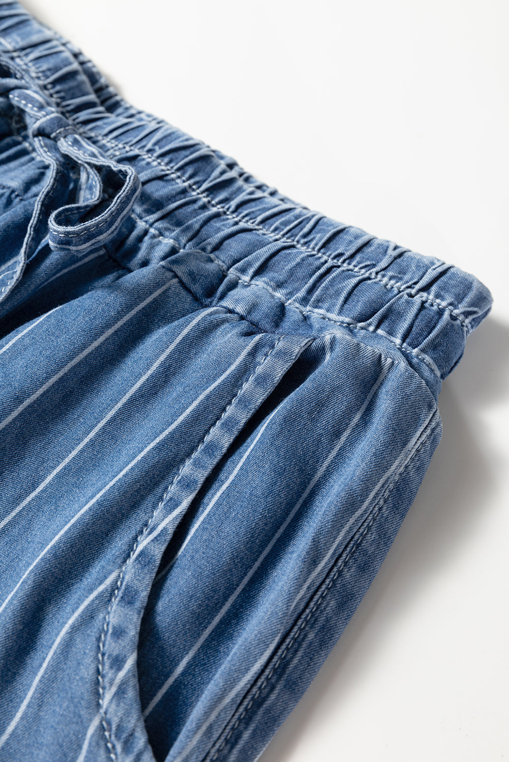 Blue pinstripe denim trousers waist with elastic band and drawstring tie