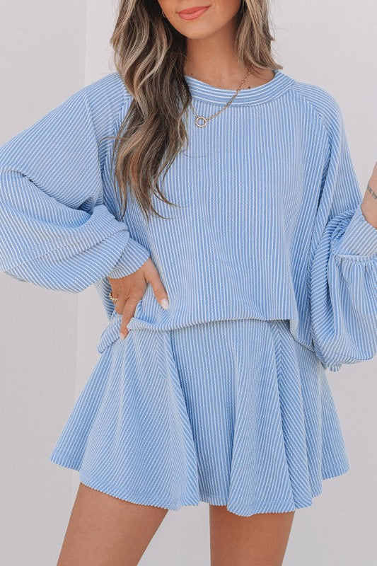 Blue corded top and ruffle mini skirt set with long sleeves and pleated ruffles