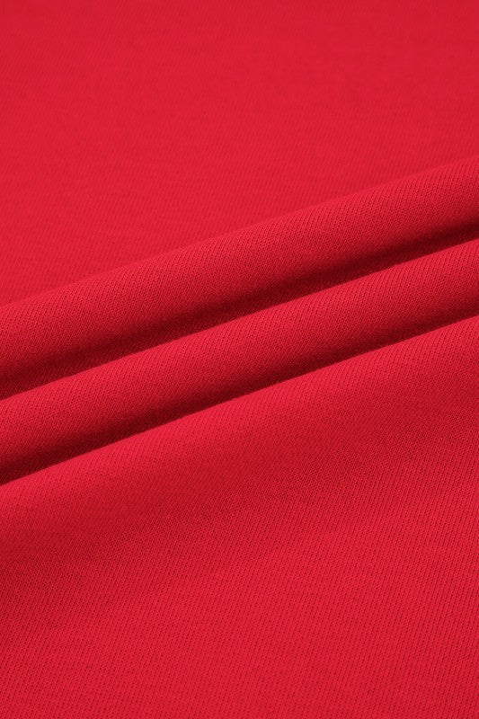 Red knit fabric texture close-up for sweatshirt and mini skirt set