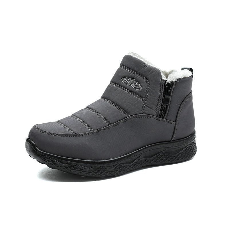 Women’s gray ankle snow boots with quilted design, faux-fur collar, and zipper