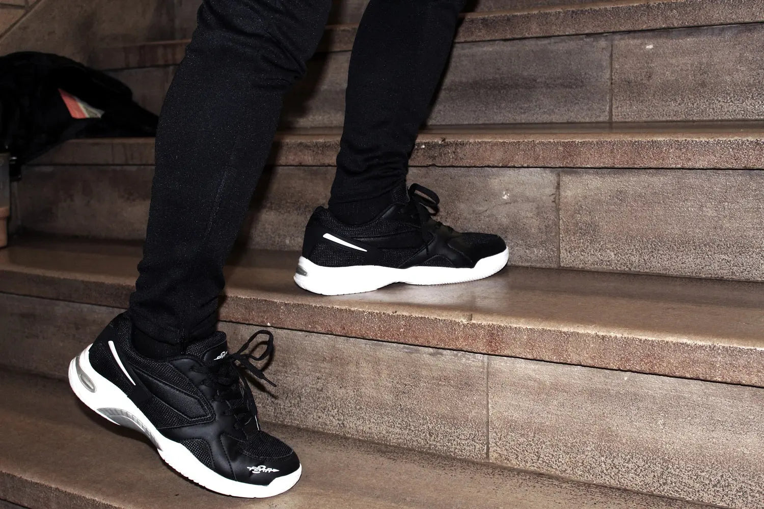 Black men’s high-arch support walking shoe with lace-up front and white outsole
