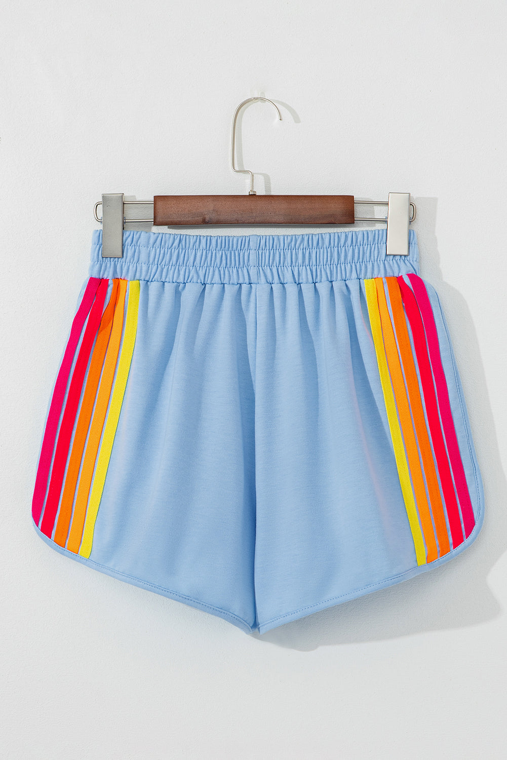 Light blue high-waist active shorts with rainbow striped side panels