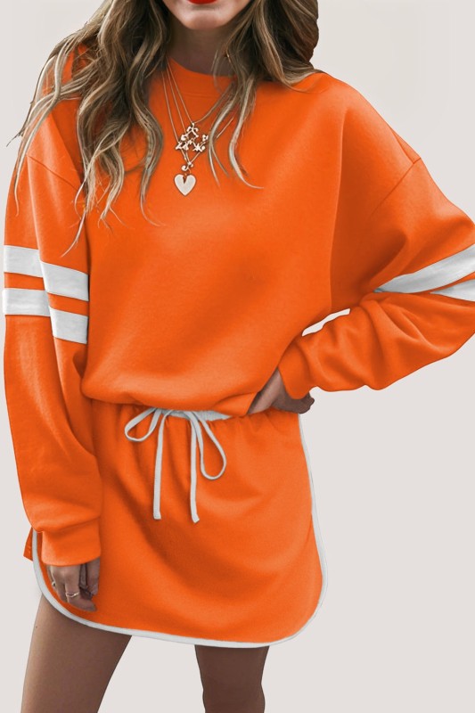 Orange varsity stripe pullover and mini skirt set with white sleeve bands and ties