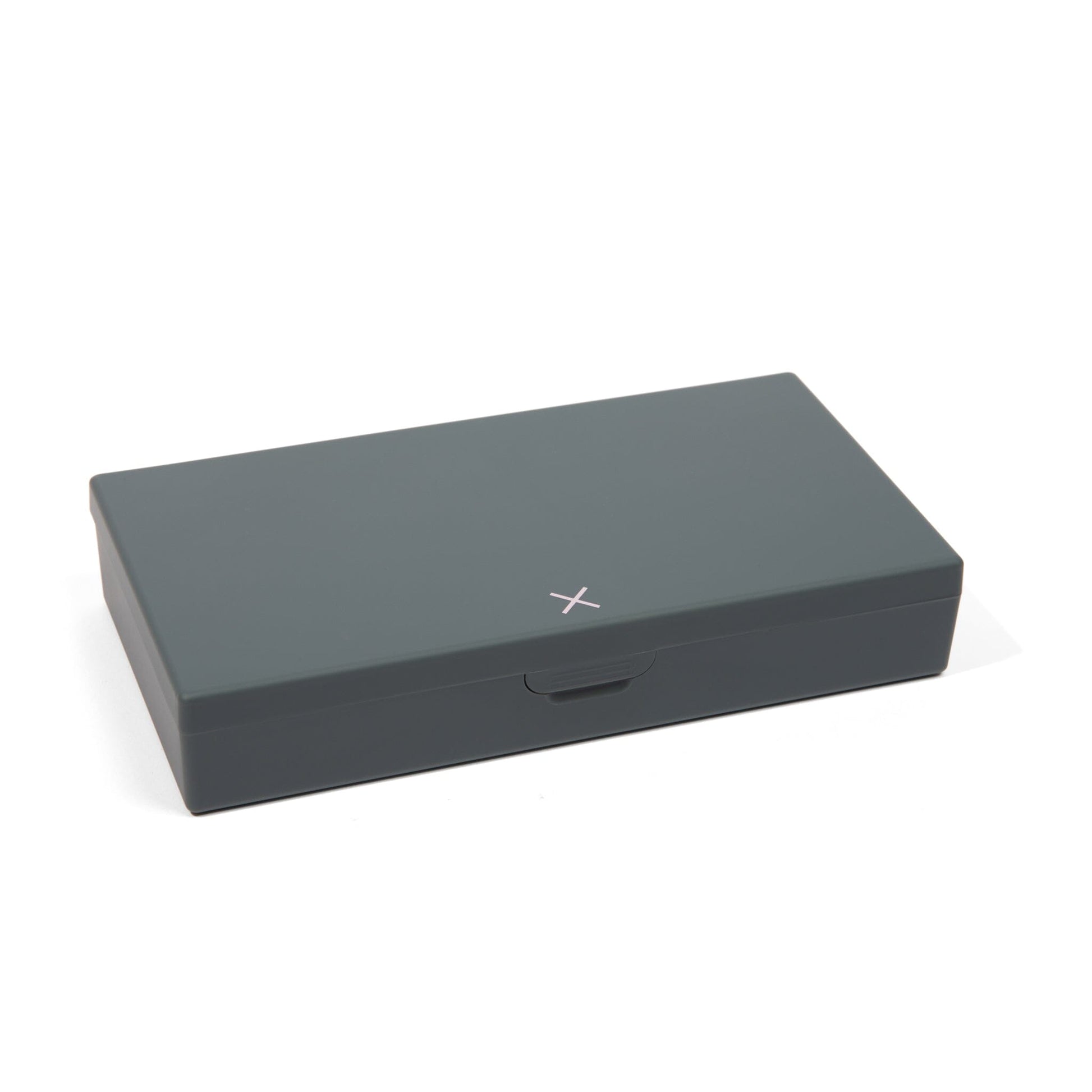 Charcoal gray AM/PM pill box closed, dark lid with small handle on front