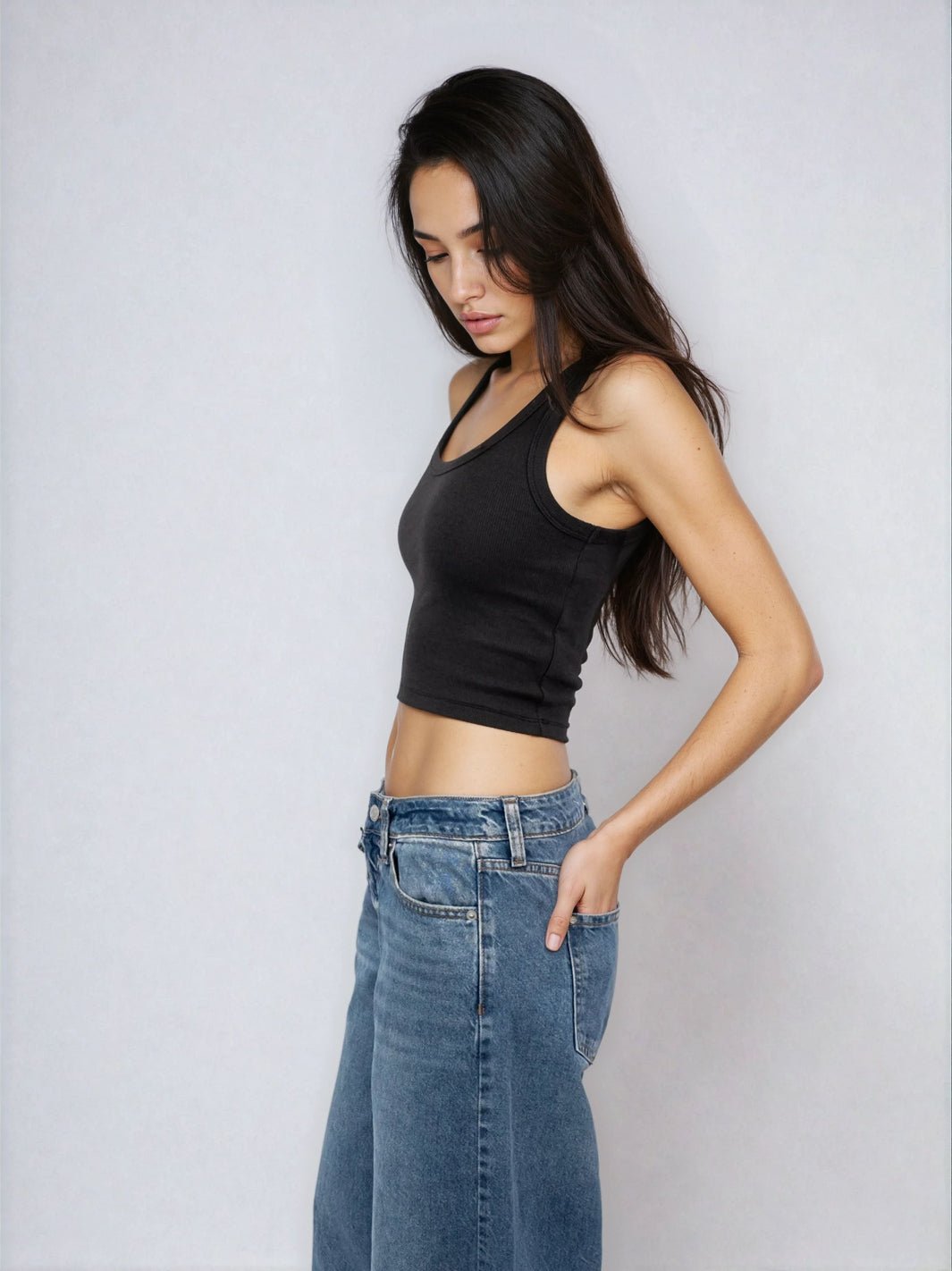 Black cropped ribbed tank top with scoop neckline and wide shoulder straps