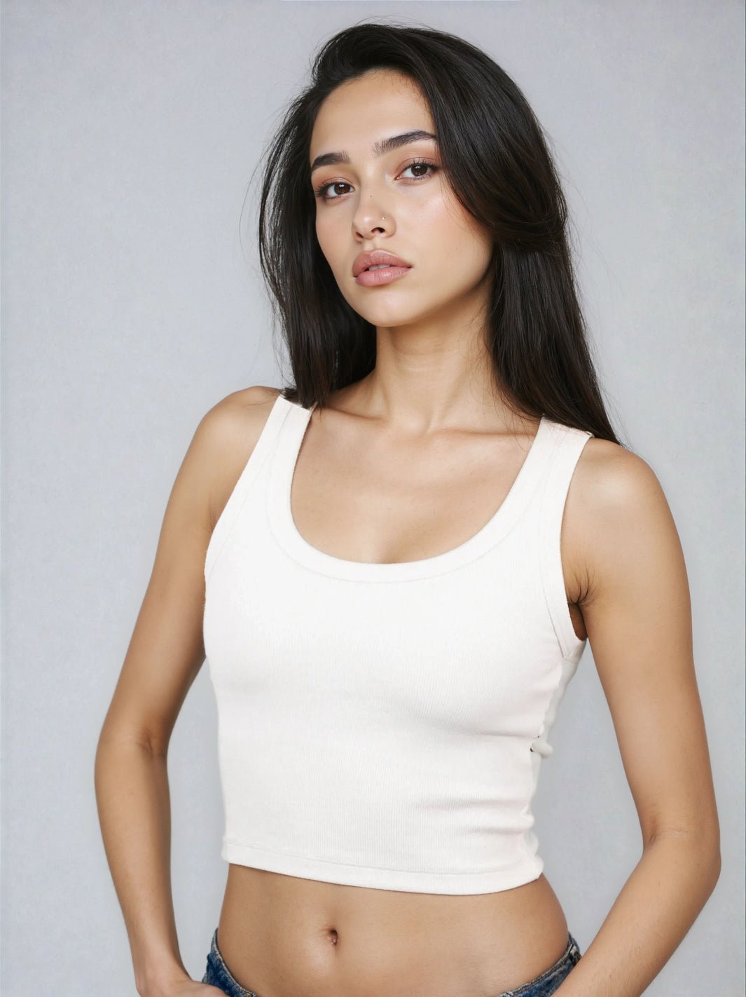 White cropped ribbed tank top with scoop neck and fitted silhouette
