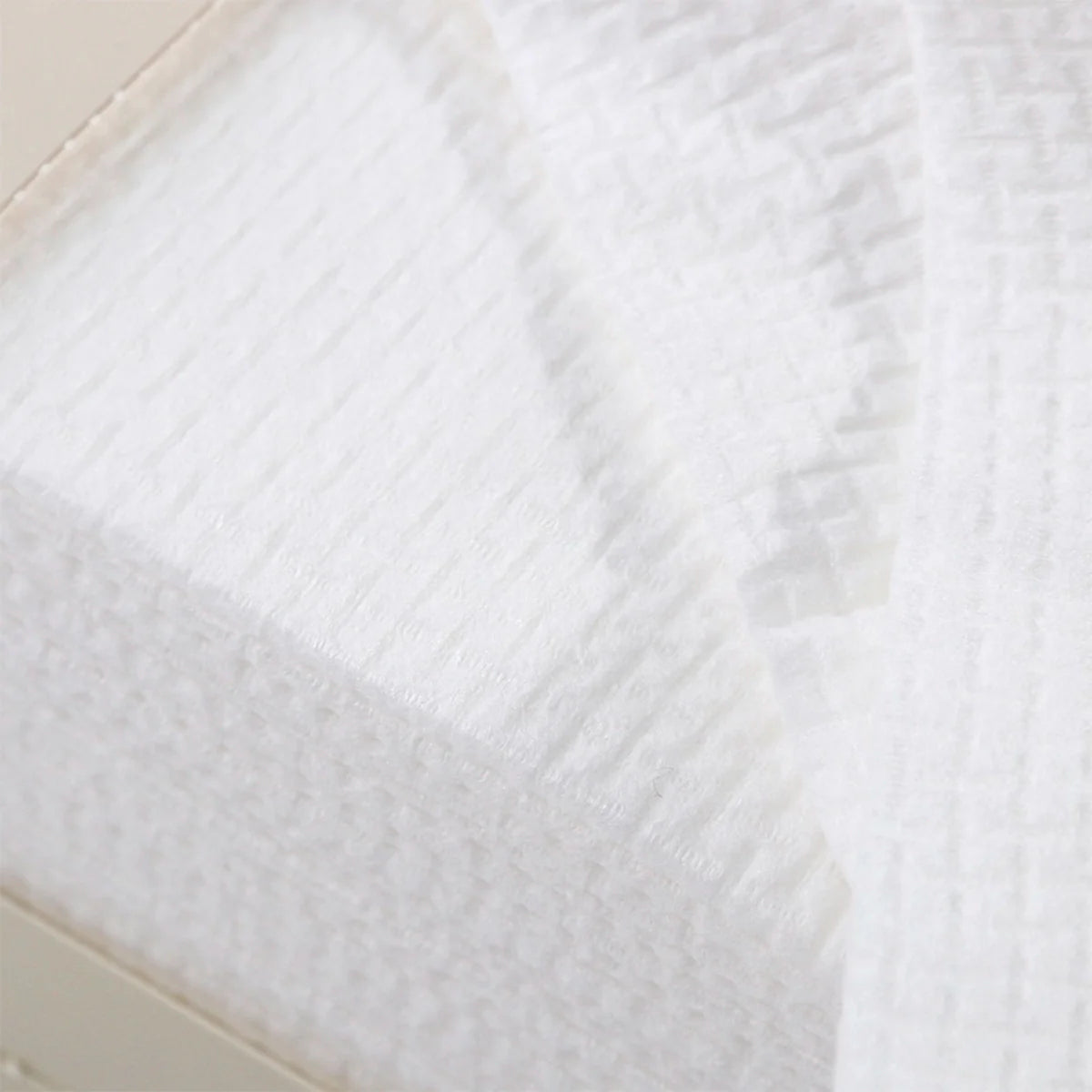 Close-up of white textured face towel fabric