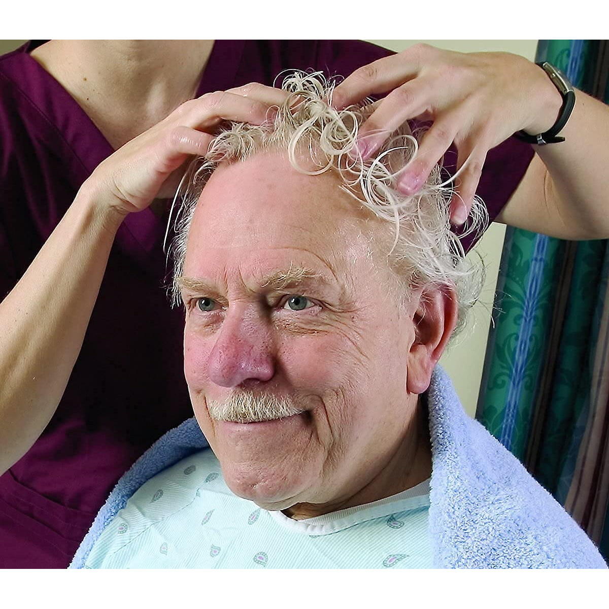 No-rinse shampoo massage in hair, hands applying while person reclines