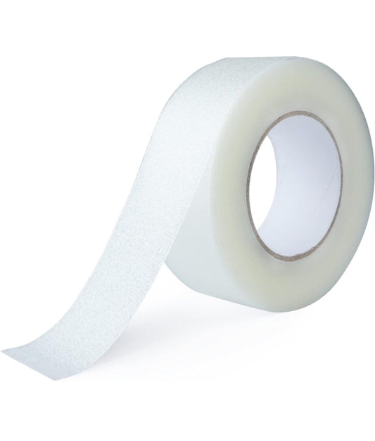 Roll of clear anti-slip stair tread tape with backing, textured grip strip