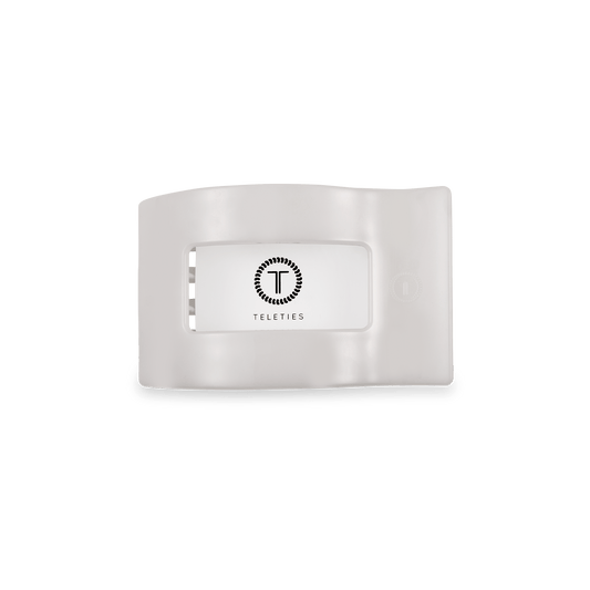 Small flat rectangle hair clip in white, inner clasp and logo emblem