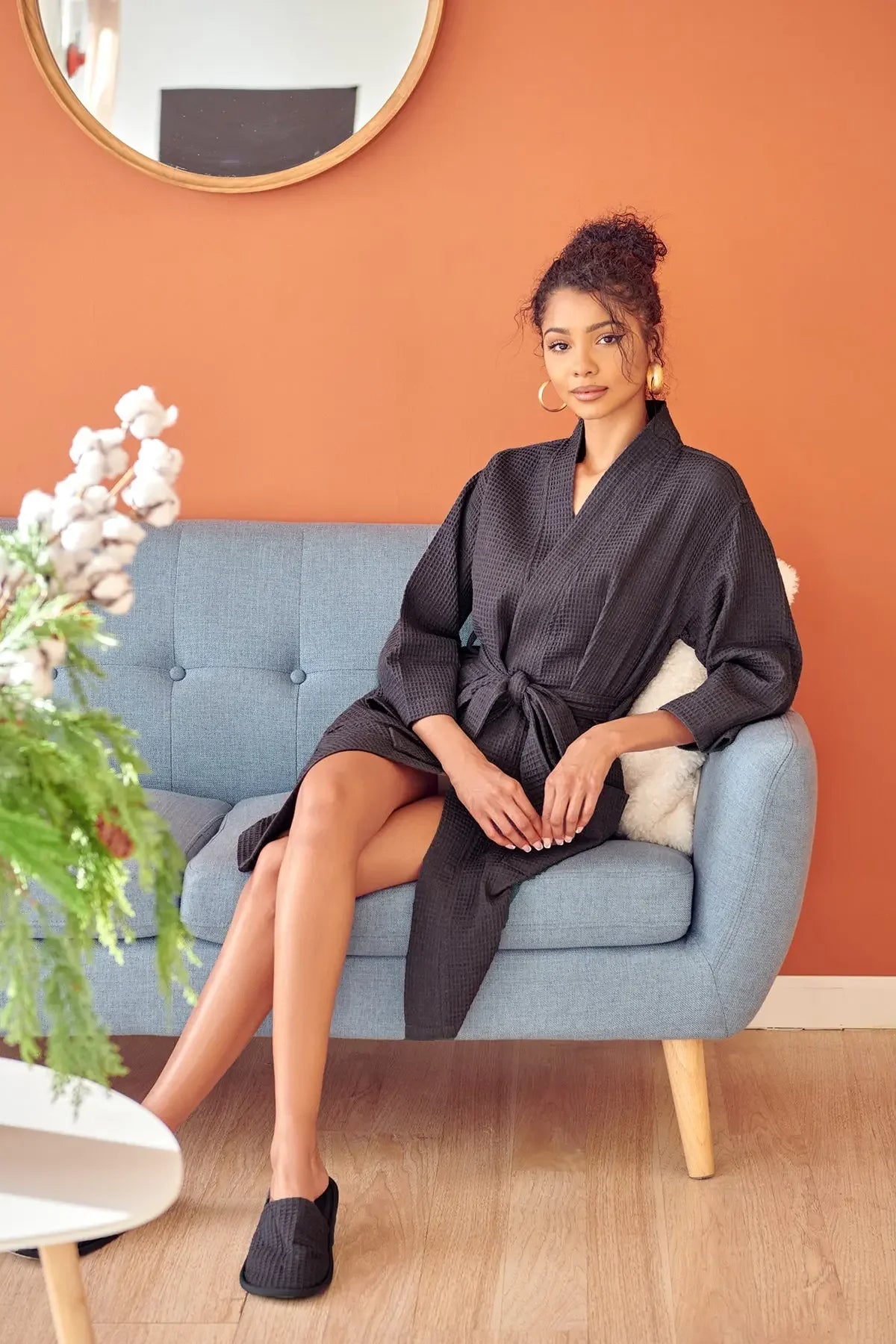 Women’s knee-length black waffle robe with V-neck and belted waist, relaxed fit